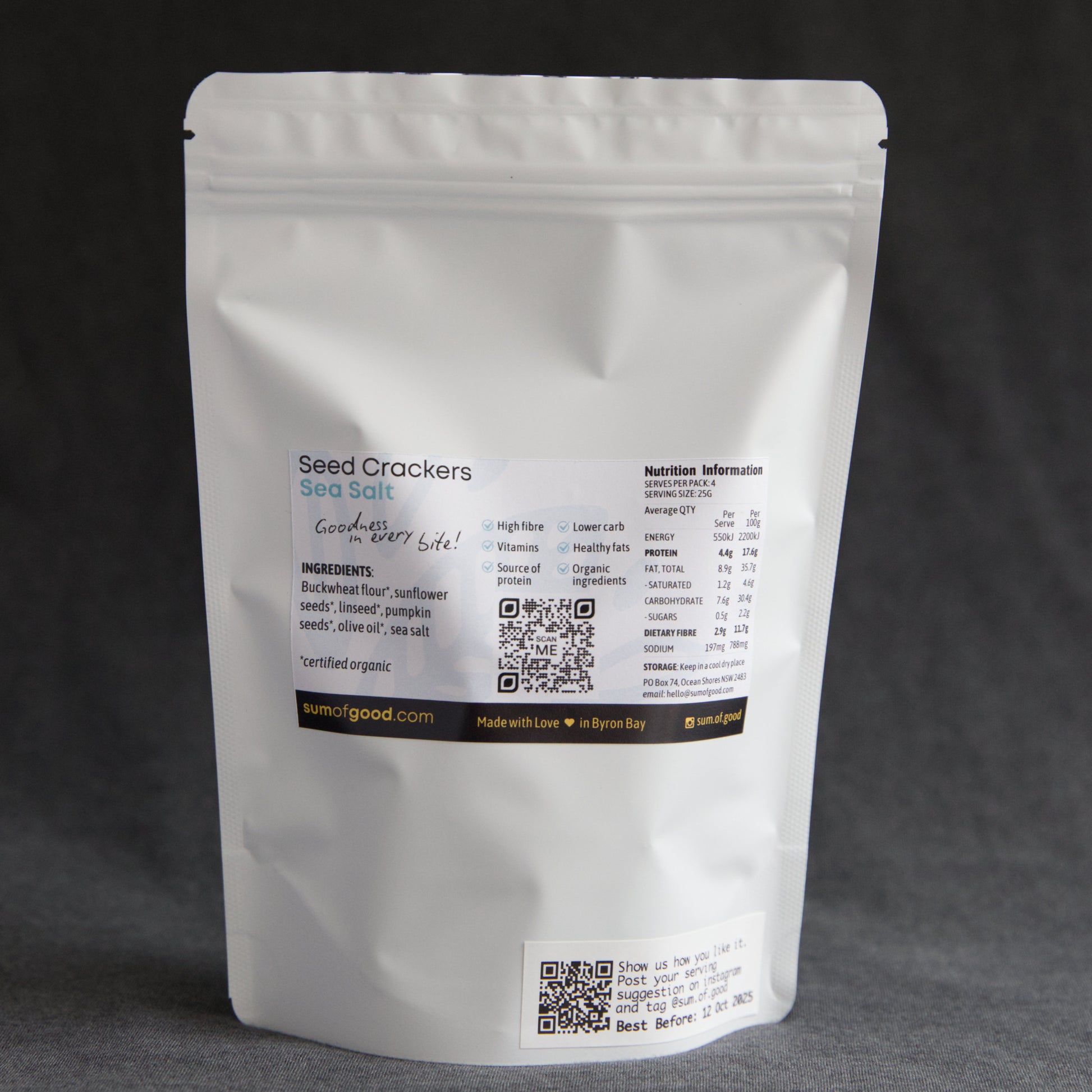 Back of packaging of Sum of Good Seed Crackers with ingredients, nutritional information and QR code on a dark background